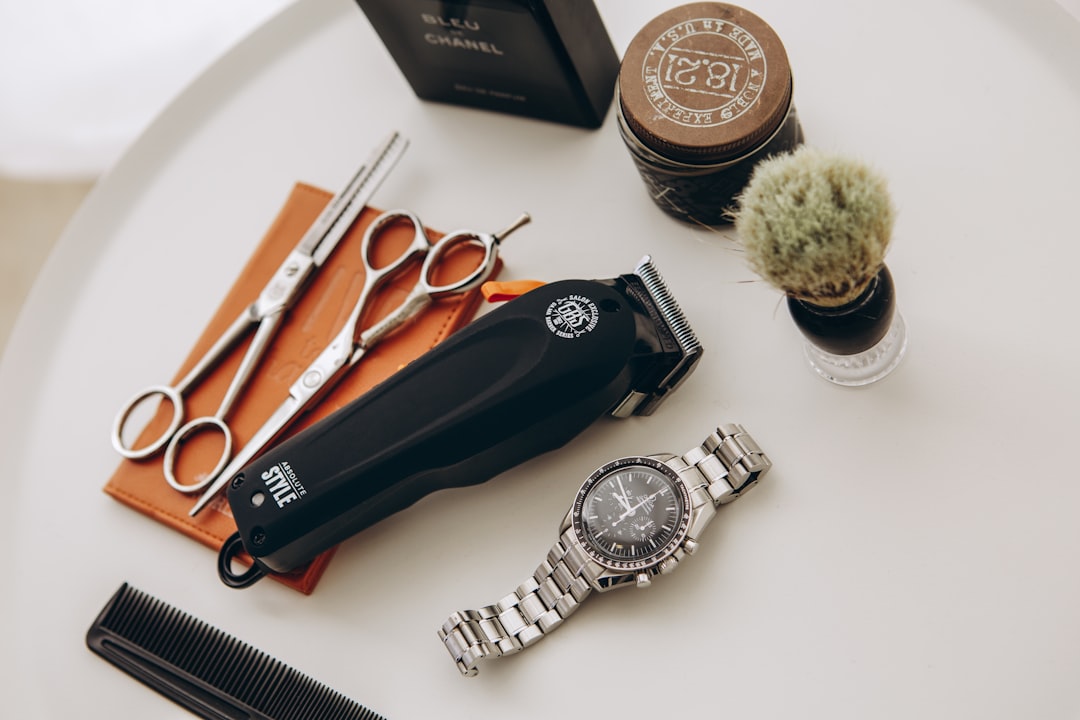black and silver pocket knife beside silver round coins
